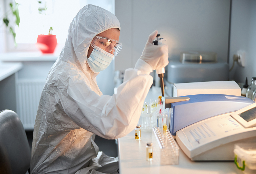 Scientist in a hazmat suit conducting research on a highly patho