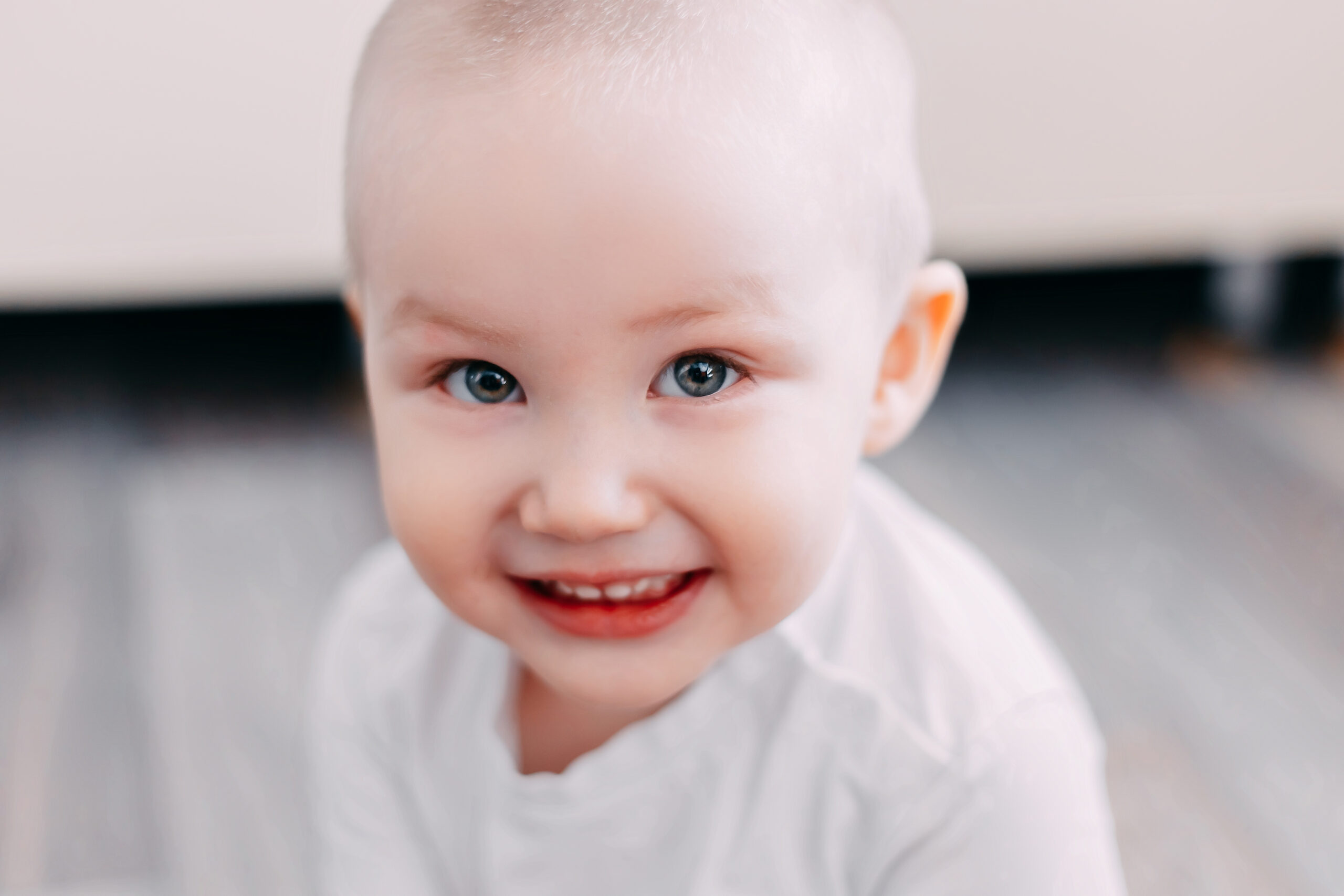 smiling baby boy focus on eyes, softfocus